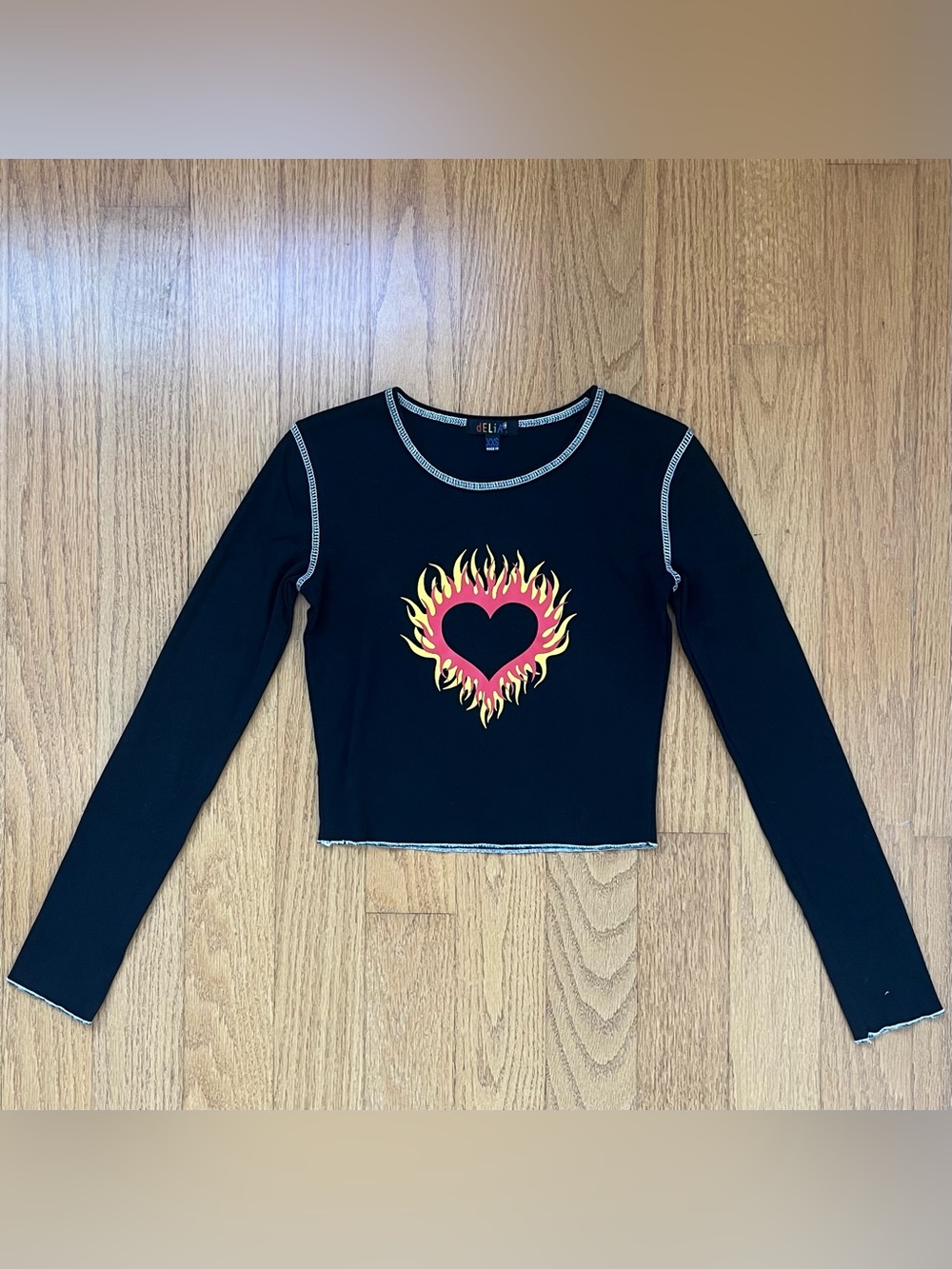Delia’s black long sleeve crop top with red & yellow flame heart graphic XXS